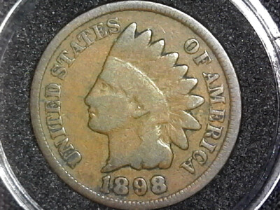 Comparison of normal 1898 Indian Head Penny date area vs. FS-402 misplaced date variety with extra digit visible in the denticles below the 9